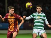 Motherwell's Blair Spittal and Celtic's Matt O'Riley during a Premier Sports Cup match between Motherwell and Celtic at Fir Park, on October 19, 2022, in Motherwell, Scotland.  (Photo by Craig Foy / SNS Group)