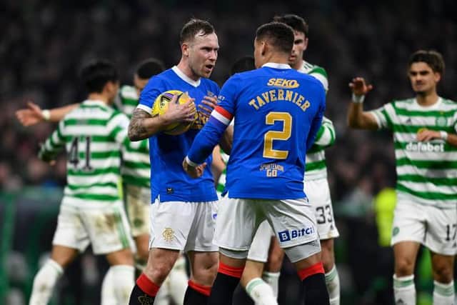 Rangers' Scott Arfield (L) and James Tavernier exchange words after going 2-0 down . (Photo by Rob Casey / SNS Group)