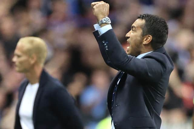 Giovanni van Bronckhorst celebrates Rangers' win over Royale Union Saint-Gilloise.