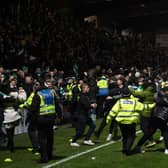 Celtic fans spill on to the pitch after Anthony Ralston's 97th minute winner in Dingwall (Photo by Craig Foy / SNS Group)
