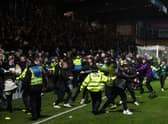 Celtic fans spill on to the pitch after Anthony Ralston's 97th minute winner in Dingwall (Photo by Craig Foy / SNS Group)