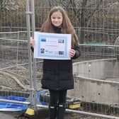 Caoimhe Donnelly with the tunnel boring machine she named The Crookie Monster.