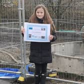 Caoimhe Donnelly with the tunnel boring machine she named The Crookie Monster.