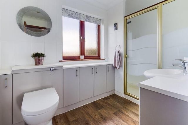 This bathroom boasts a large shower enclosure; it is one of three bathrooms in this incredible family home.