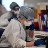 Under pressure: A member of staff at University Hospital Monklands makes a telephone call on the ICU ward.. Photo by Jeff J Mitchell/Getty Images