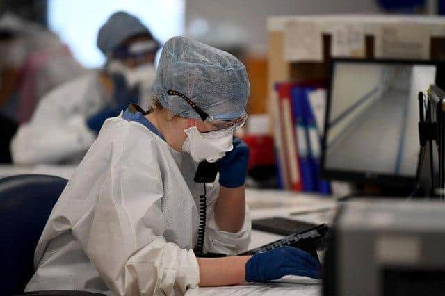 Under pressure: A member of staff at University Hospital Monklands makes a telephone call on the ICU ward.. Photo by Jeff J Mitchell/Getty Images