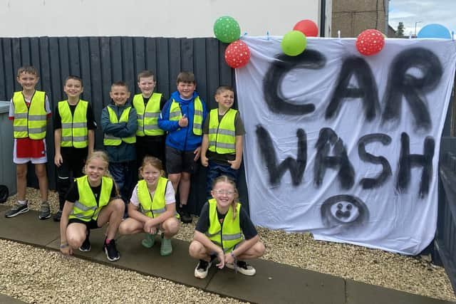 Industrious car wash crew were kept very busy on Sunday afternoon.