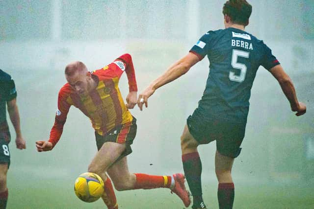 Raith's Christoph Berra challenges Partick Thistle's Zak Rudden (picture by Euan Cherry / SNS Group)