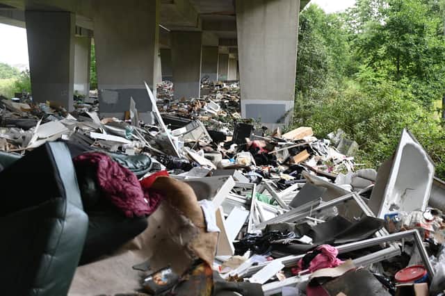 Huge piles of rubbish under the M8.
