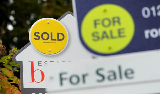 EMBARGOED TO 00001 TUESDAY OCTOBER 26 File photo dated 14/10/14 of estate agents boards. The housing market is set to record its highest level of sales this year since 2007, according to a property website. Issue date: Tuesday October 26, 2021.