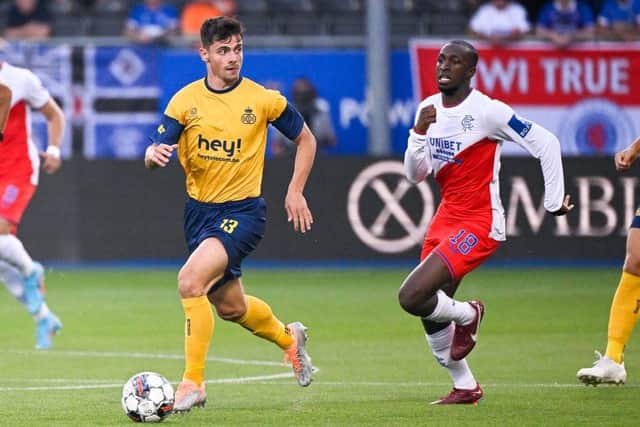 Union's Belgian forward Dante Vanzeir and Rangers' Finnish midfielder Glen Kamara fight for the ball during the UEFA Champions League third qualifying round first leg (Photo by LAURIE DIEFFEMBACQ/BELGA/AFP via Getty Images)