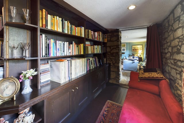 Between the two living rooms is a library style hall, complete with bespoke, handmade bookshelves.