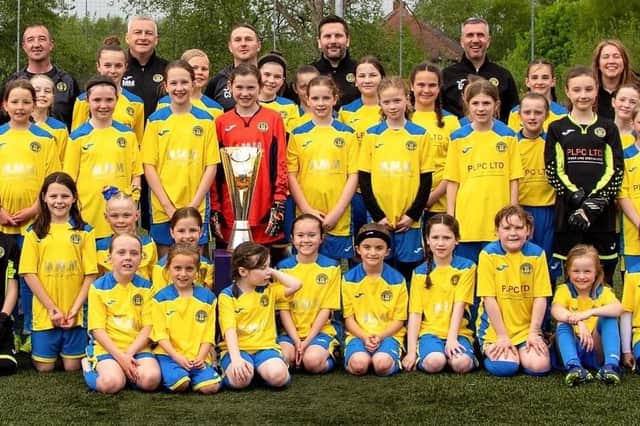 Scottish Women's Football chief executive officer Aileen Campbell with members of various Milton Rovers girls' teams (Photo: Kevin Ramage)