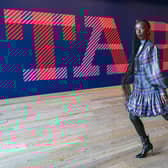 Model Eunice Olumide wears a tartan designed by Charles Jeffery during a preview for the forthcoming Tartan exhibition at V&A Dundee. Picture: Jane Barlow/PA Wire