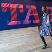 Model Eunice Olumide wears a tartan designed by Charles Jeffery during a preview for the forthcoming Tartan exhibition at V&A Dundee. Picture: Jane Barlow/PA Wire