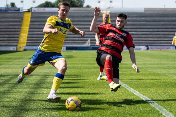 Clyde’s Adam Livingstone tries to prevent Morton’s Darren Hynes getting the ball into the danger area (pic: GBR Photos)