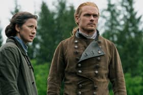 Sam Heughan as Jamie Fraser, with Caitriona Balfe as Claire, in season seven of Outlander, 2023. Pic: Starz! Movie Channel/Everett/Shutterstock