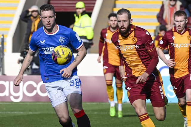 Rangers' Leon King was booked for a tackle on Motherwell's Stuart McKinstry.