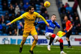 Ciaron Brown (left) battling against Rangers’ Ryan Kent in a game at Ibrox. Picture: SNS