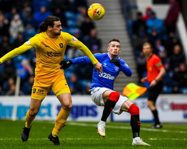 Ciaron Brown (left) battling against Rangers’ Ryan Kent in a game at Ibrox. Picture: SNS