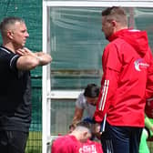 Neil Schoneville (right) is pictured talking to ex-Bellshill Athletic manager Derek Wilson (Pic by David Grimason)