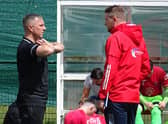 Neil Schoneville (right) is pictured talking to ex-Bellshill Athletic manager Derek Wilson (Pic by David Grimason)