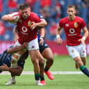 Lions prop Rory Sutherland fending off a tackle by Japan's Michael Keitch at Edinburgh's Murrayfield Stadium on Saturday (Photo by Stu Forster/Getty Images)
