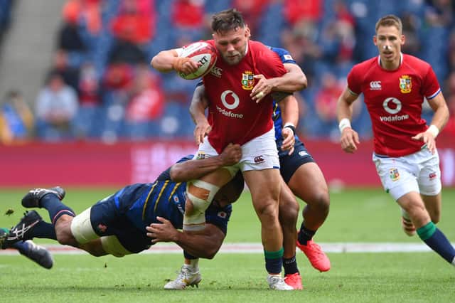 Lions prop Rory Sutherland fending off a tackle by Japan's Michael Keitch at Edinburgh's Murrayfield Stadium on Saturday (Photo by Stu Forster/Getty Images)