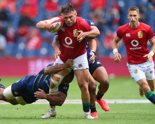 Lions prop Rory Sutherland fending off a tackle by Japan's Michael Keitch at Edinburgh's Murrayfield Stadium on Saturday (Photo by Stu Forster/Getty Images)