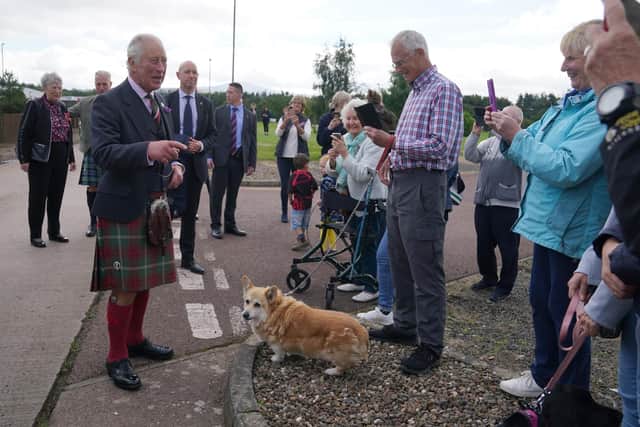 Duke of Rothesay took time out to speak to well-wishers after viewing Lanark's Mighty Clydesdale, even taking time to pet the wee corgi - a breed Her Majesty loved.