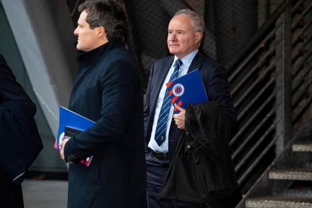 Rangers vice-chairman John Bennett (right) is pictured leaving the Ibrox club's AGM on Tuesday. (Photo by Ross MacDonald / SNS Group)