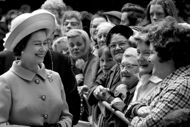 Queen Elizabeth II meets some of the residents at the new multi-storey flats in the Gorbals in July 1972.