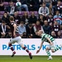Alex Cochrane, right, is judged to have fouled Daizen Maeda, leading to a red card for the Hearts player. Picture: SNS