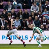 Alex Cochrane, right, is judged to have fouled Daizen Maeda, leading to a red card for the Hearts player. Picture: SNS