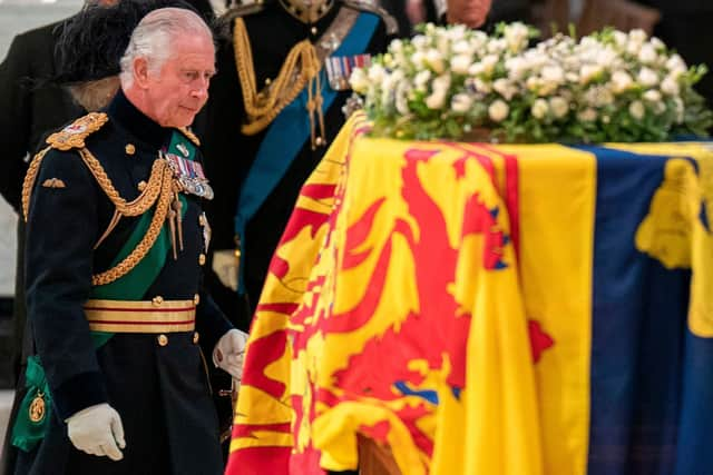 King Charles walks past the coffin of his late mother, Queen Elizabeth, at St Giles Cathedral in Edinburgh during a service of thanksgiving for her life (Picture: Jane Barlow/pool/AFP via Getty Images)