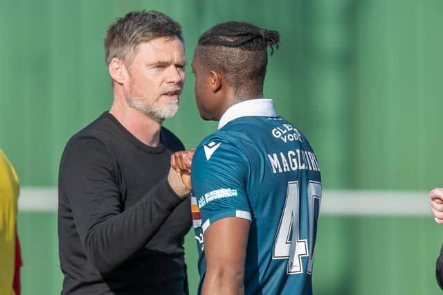 Motherwell manager Graham Alexander congratulating Tyler Magloire after their side's Scottish Cup victory over Formartine United at North Lodge Park in Pitmedden on Saturday (Photo by Dave Cowe)