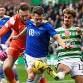 Celtic's Jota (right) competes with Craig Bryson during the cinch Premiership match between Celtic and St Johnstone. (Photo by Rob Casey / SNS Group)