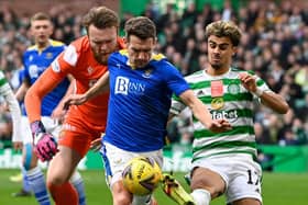 Celtic's Jota (right) competes with Craig Bryson during the cinch Premiership match between Celtic and St Johnstone. (Photo by Rob Casey / SNS Group)
