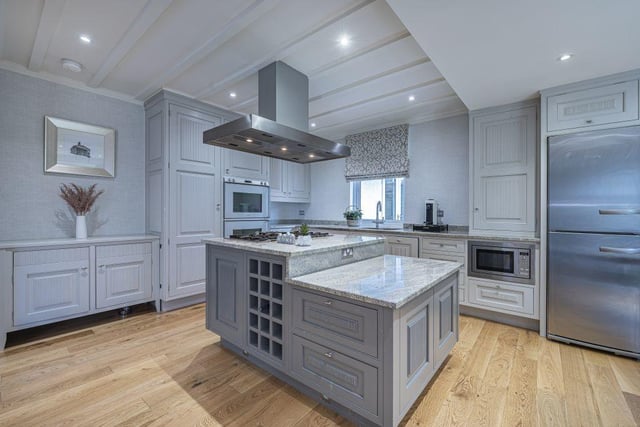 The kitchen features Gaggenau appliances and was hand painted.