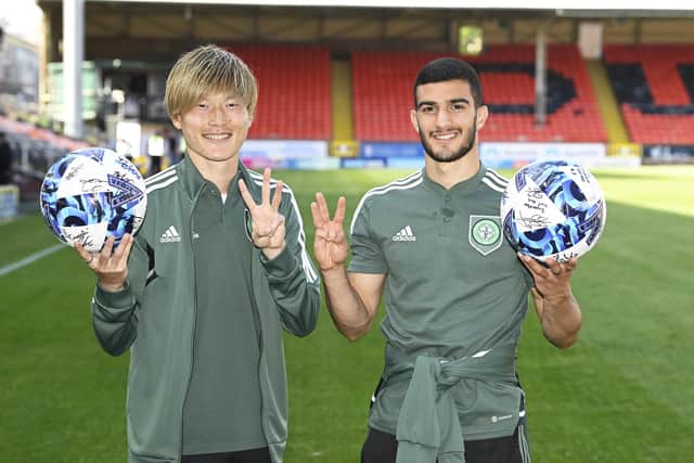 Celtic's latest hat-trick scorer Kyogo Furuhashi and Liel Abada may be thankful for the multi-ball era as they hold the spoils for their triples in the 9-0 demolition of Dundee United. (Photo by Rob Casey / SNS Group)
