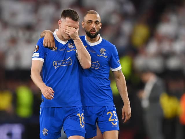 Rangers midfielder Aaron Ramsey is consoled by Kemar Roofe after missing the decisive penalty in the shoot-out as Eintracht Frankfurt won the Europa League final.