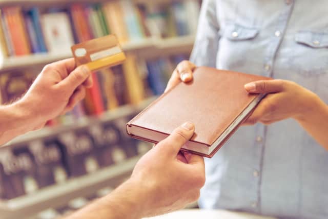 Swap from buying books to borrowing with a library card (photo: Adobe)