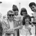 TV presenter Paul Coia pours champagne for Keith Dunn, here with his wife and daughters. Mr Dunn was the 1,000,000th visitor to the Glasgow Garden Festival in June 1988.