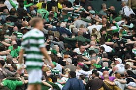 Thousands of Celtic fans often celebrate a goal or a victory by linking arms and facing away from the park before taking part in a mass huddle.