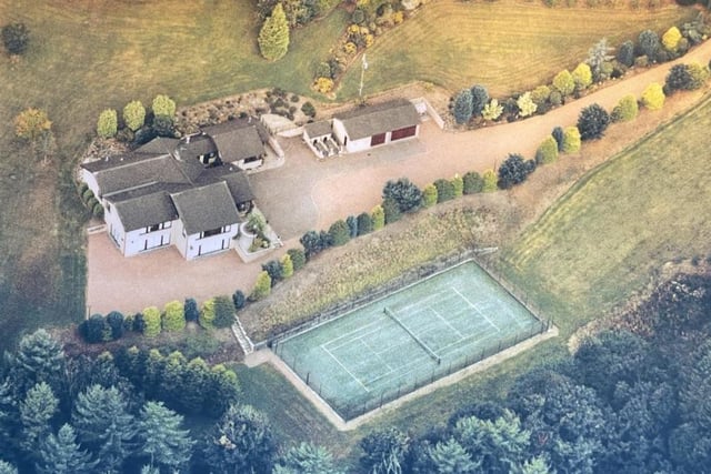 Aerial view gives the best picture of this sizeable Kirkfieldbank property, set in four acres with its own tennis courts.