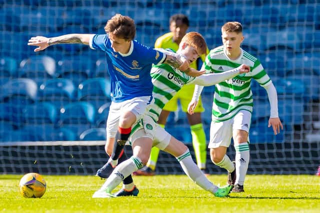 Rangers Alex Lowry tackles Celtic's Ben Summers during a Lowland League match between Rangers B and Celtic B.