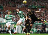 Ricki Lamie battles for the ball with Tom Rogic