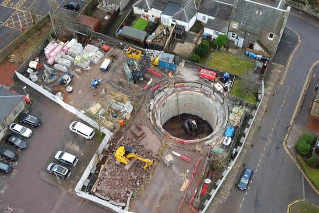 Scottish Water has completed its £2.5 million project to help drain the rain and protect the centre of Lanark, which also saw a training exercise with the SFRS.