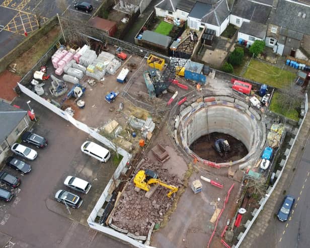 Scottish Water has completed its £2.5 million project to help drain the rain and protect the centre of Lanark, which also saw a training exercise with the SFRS.