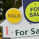 General view of estate agents signs outside a block of flats in Basingstoke, Hampshire.